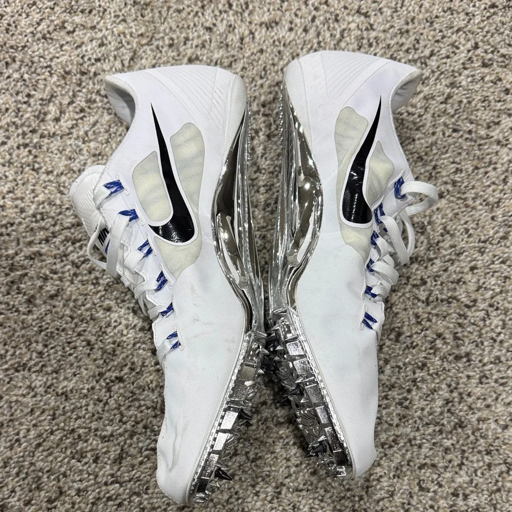 Nike fly wire White Track Spikes with Black Swoosh and Blue Accents